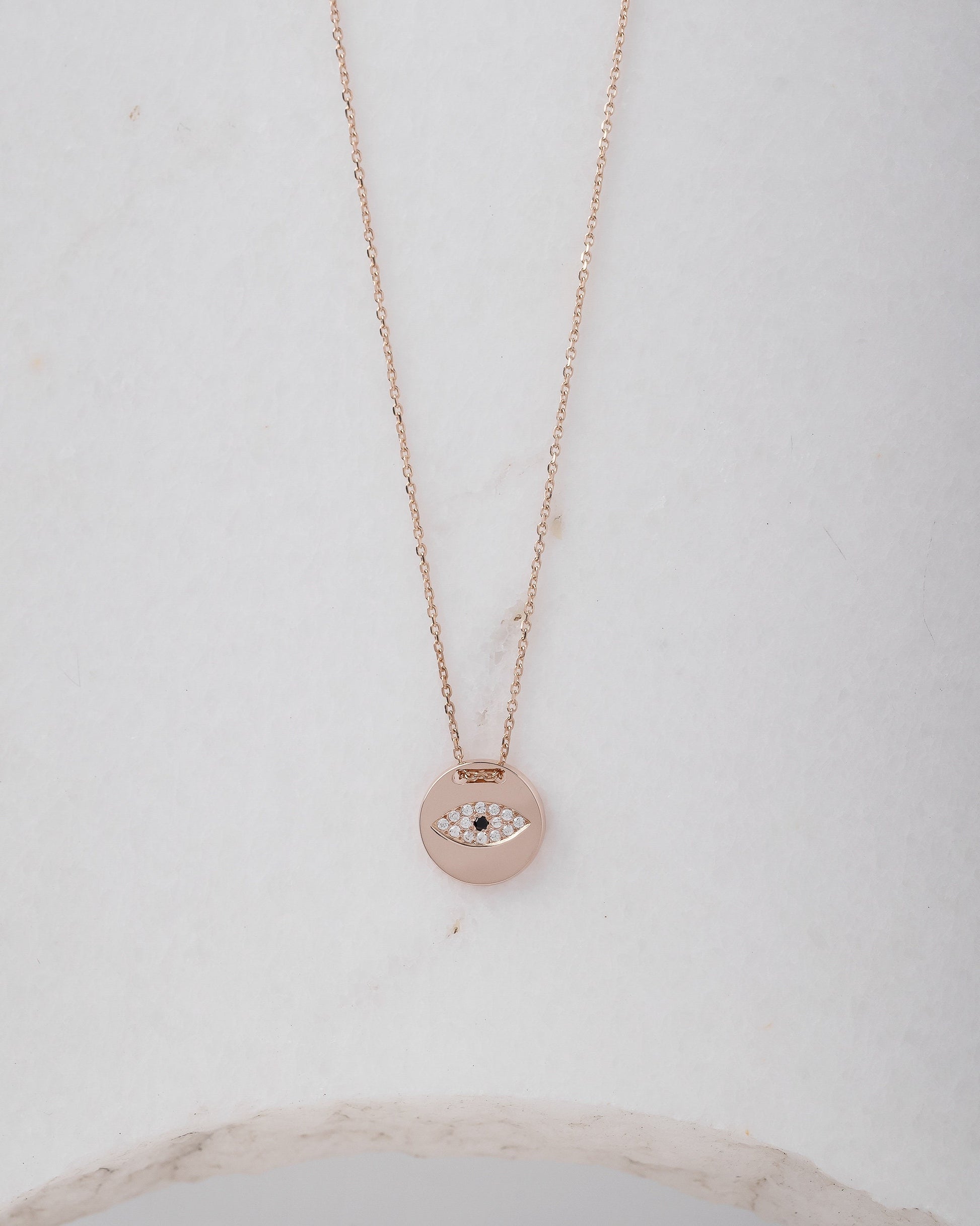 Pavé evil eye necklace in 14k yellow gold for women.