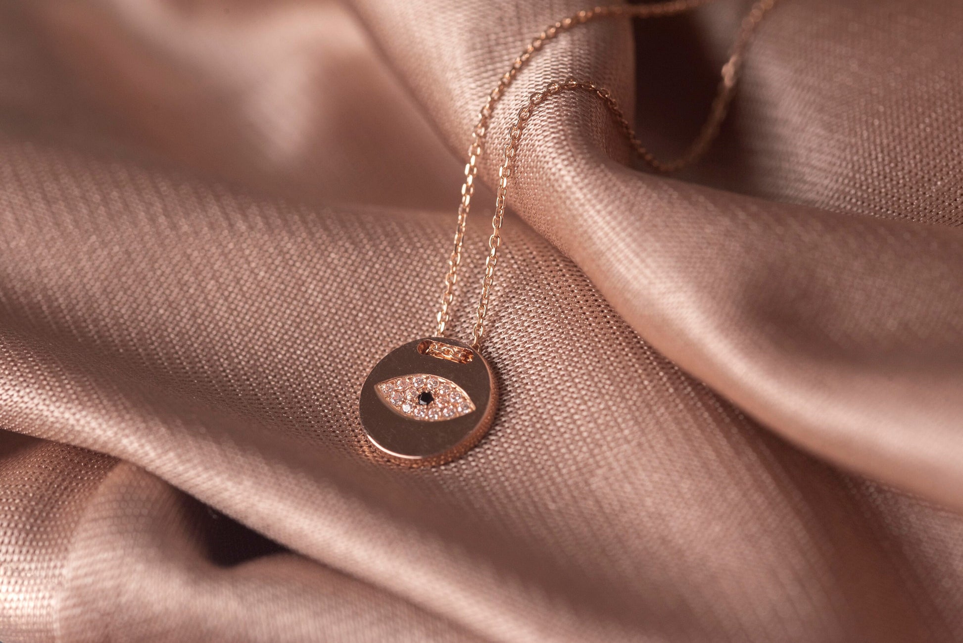 Pavé evil eye necklace in 14k yellow gold for women.