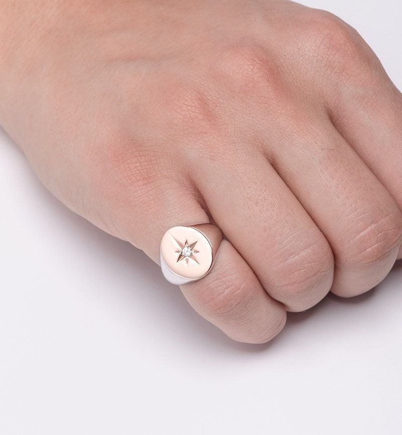 A star signet ring crafted in 14k solid gold for women.