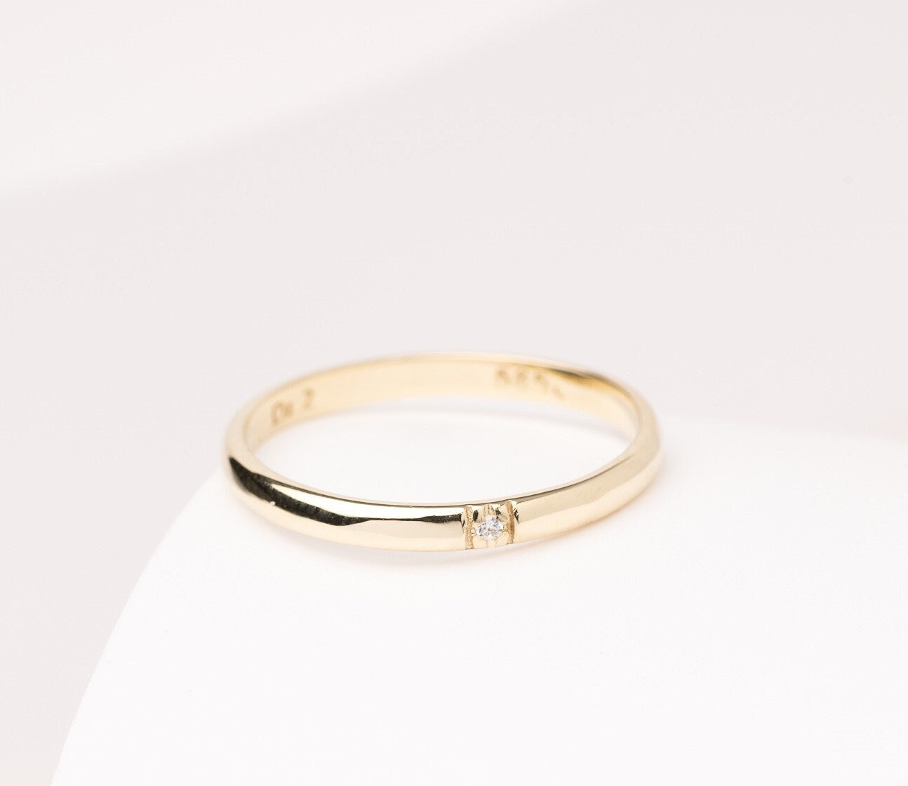 A minimalist diamond band ring crafted in 14k solid gold for women.