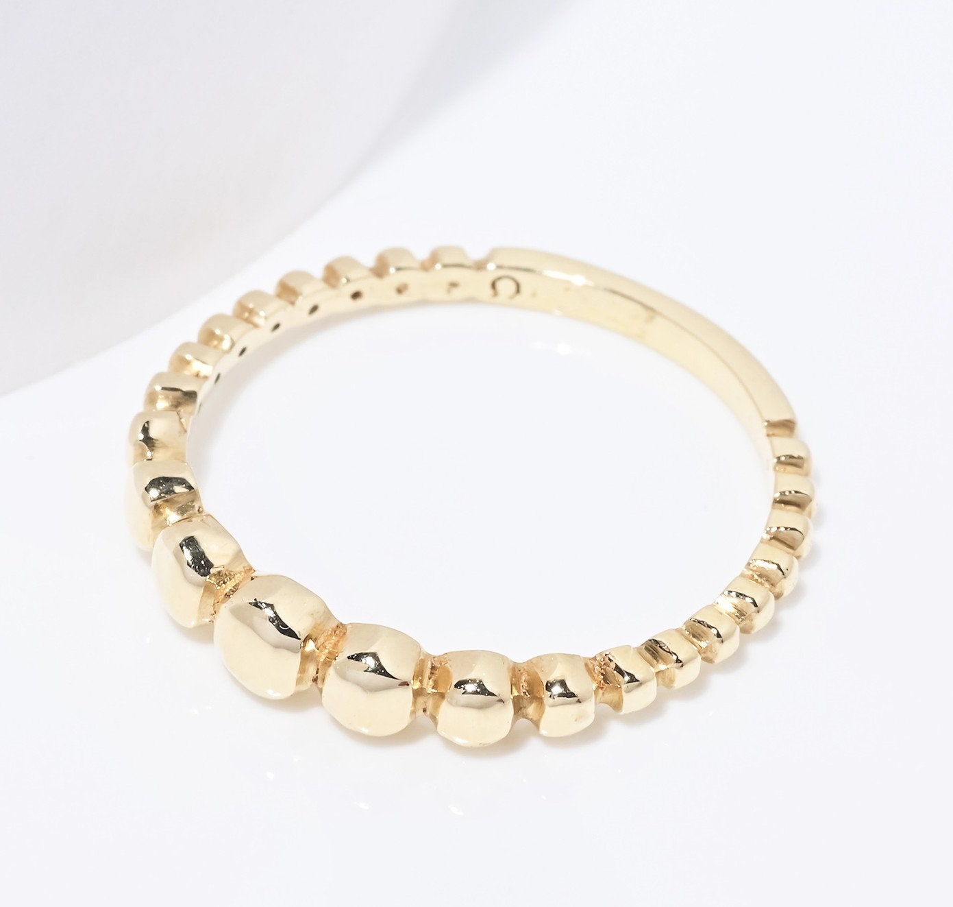 A beaded ring crafted from 14k solid gold for women.