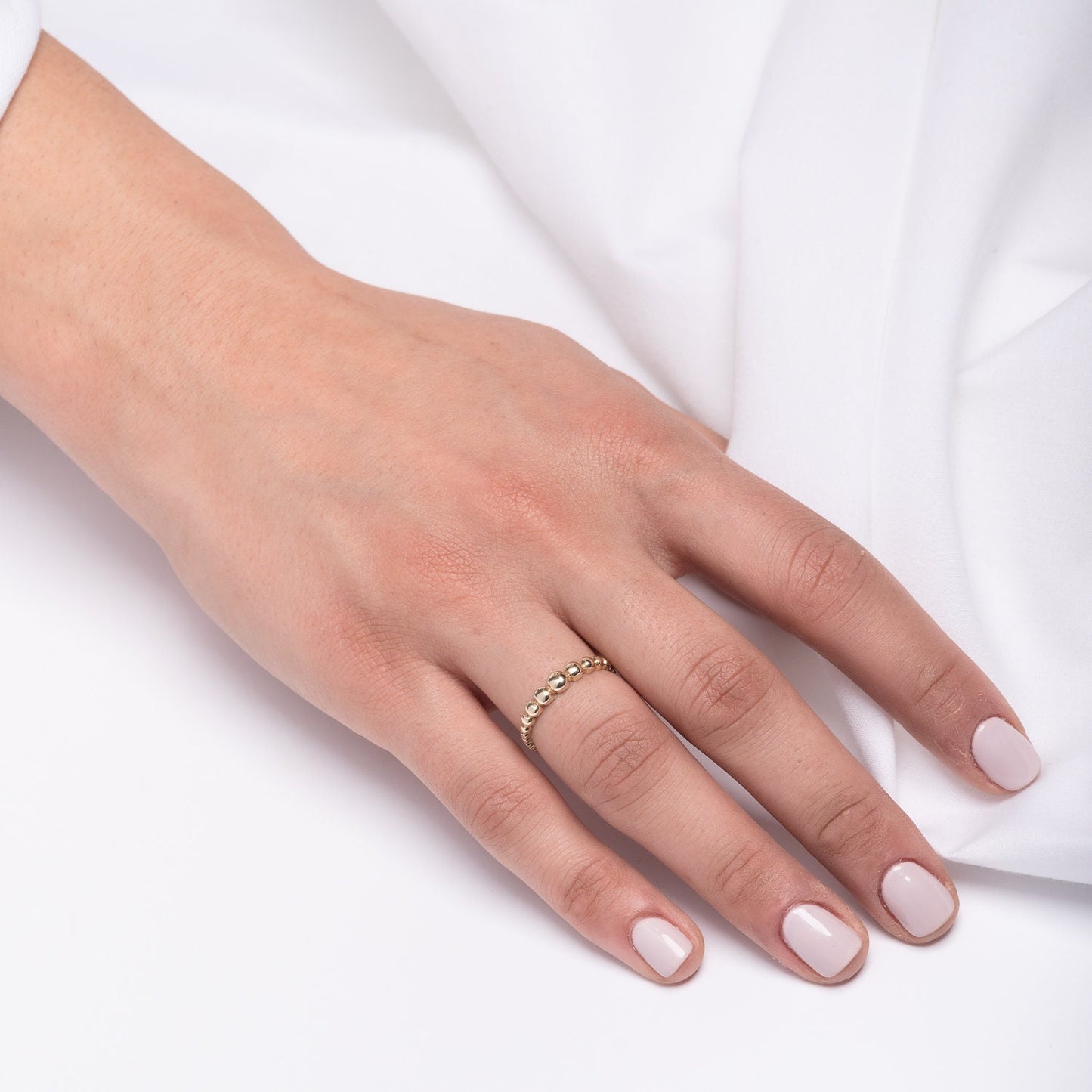 A beaded ring crafted from 14k solid gold for women.