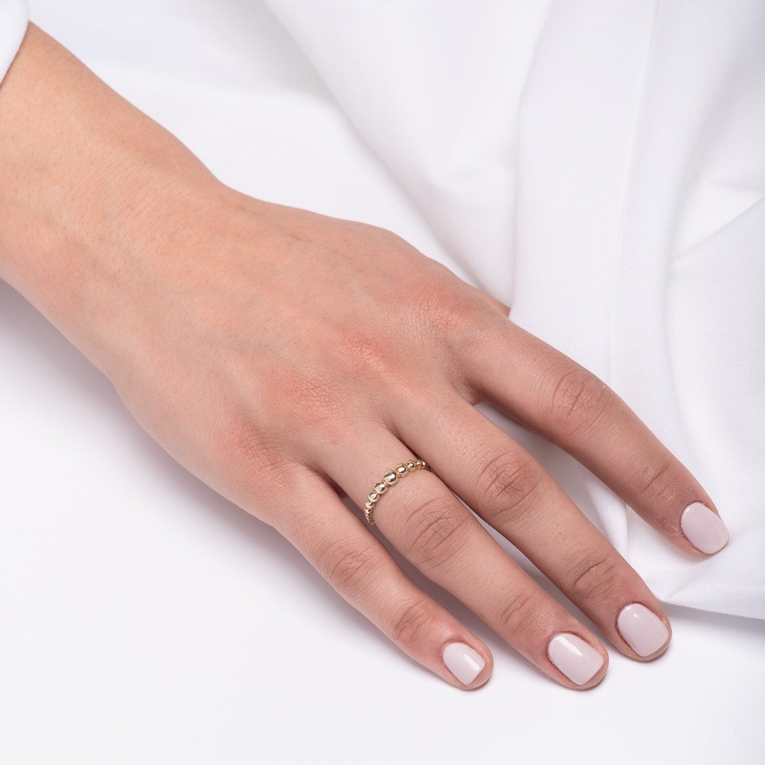 A beaded ring crafted from 14k solid gold for women.