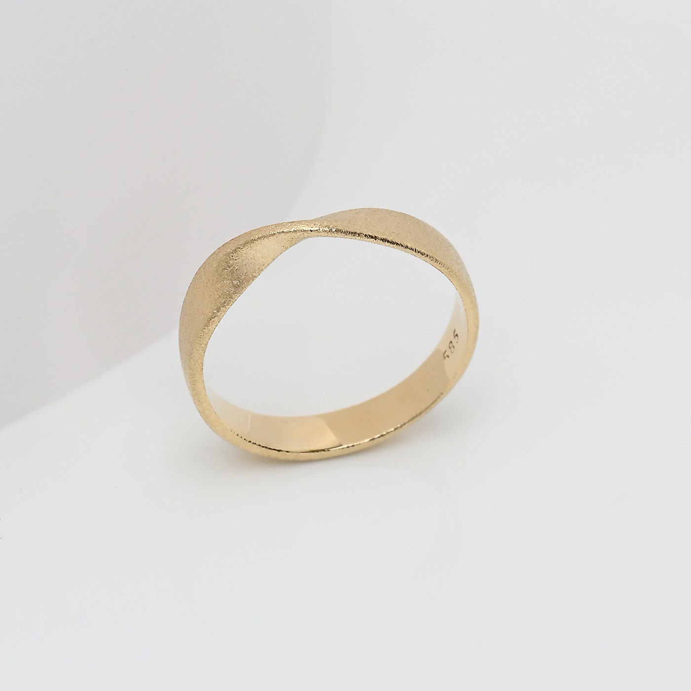 Sandblasted Möbius Ring in 14k solid gold for women.