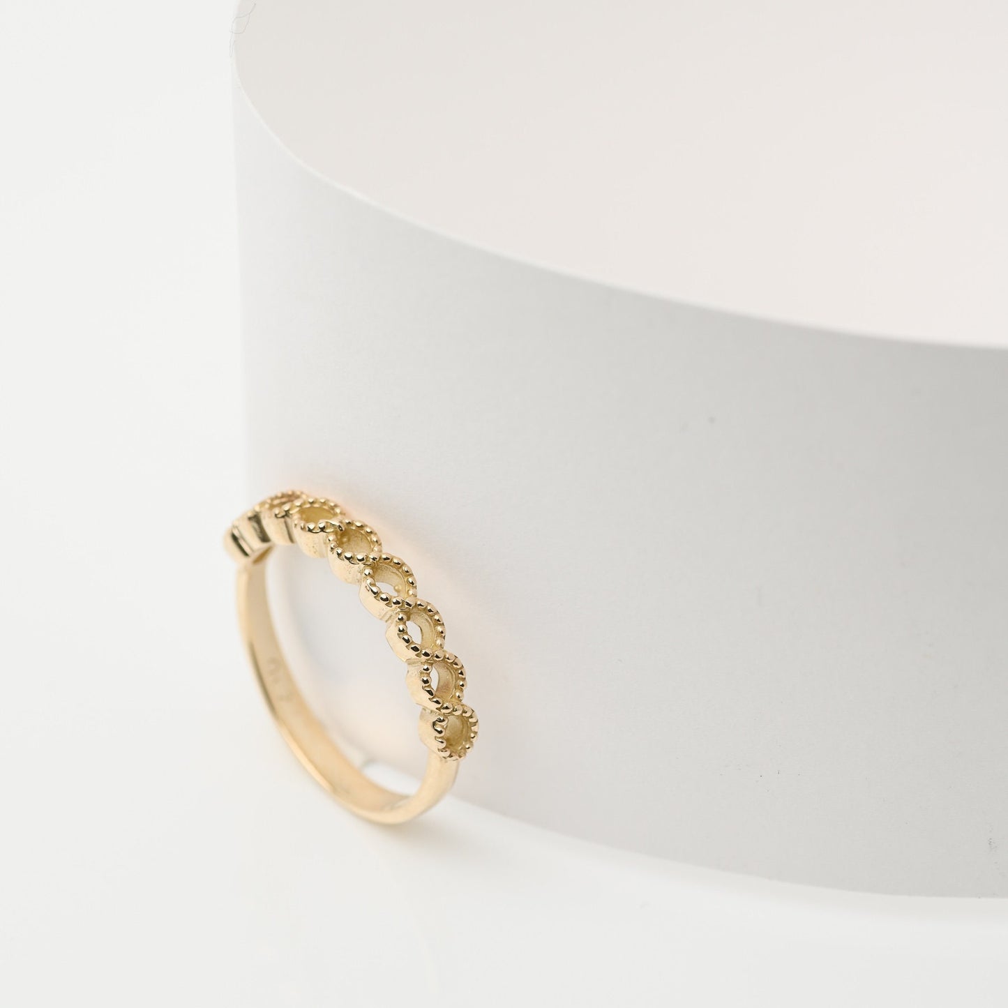 Handcrafted 14k solid gold ring featuring openings on the upper section.