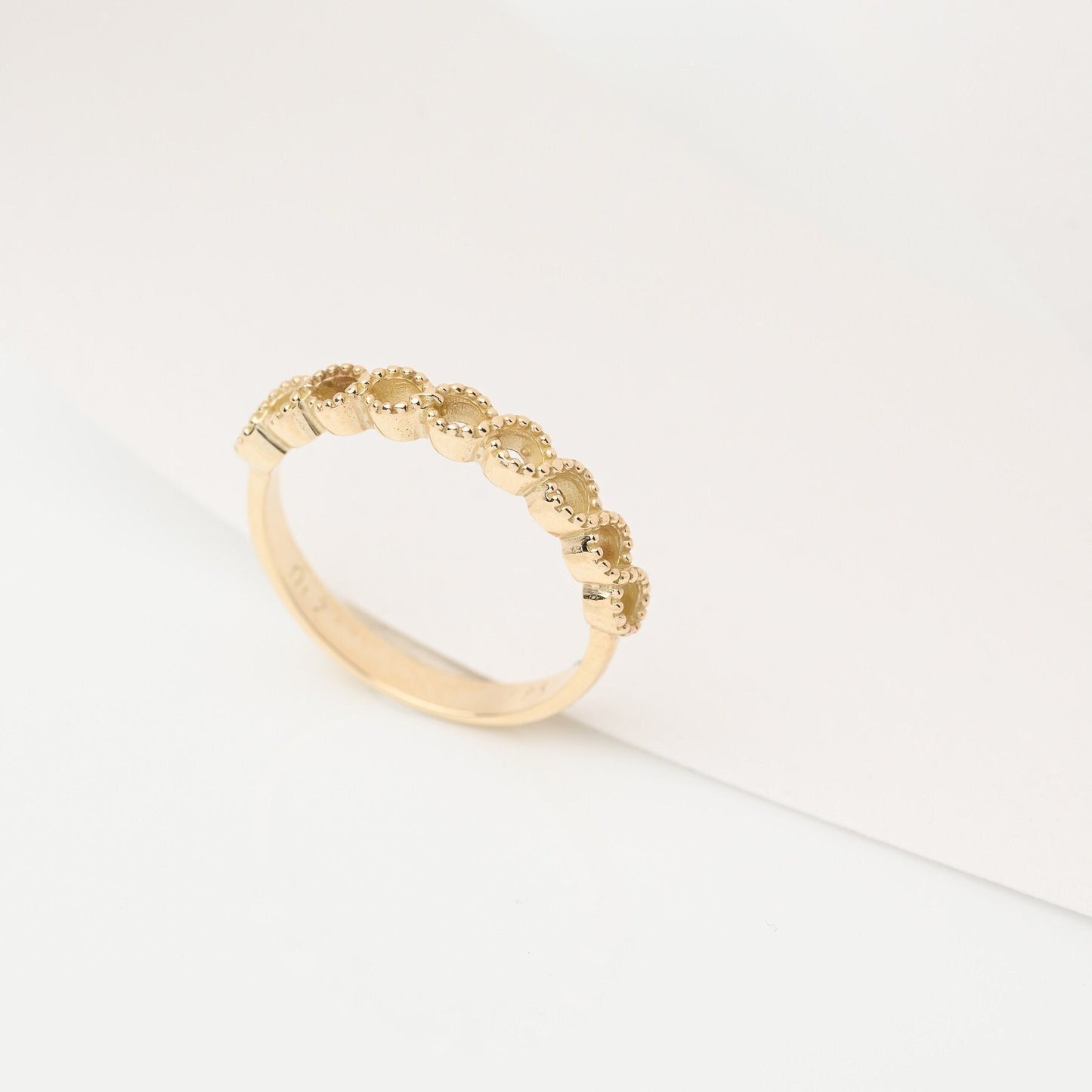 Handcrafted 14k solid gold ring featuring openings on the upper section.