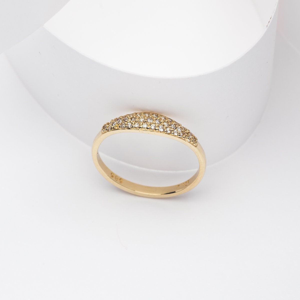 Handcrafted 14k solid gold ring set with white cubic zirconia stones, designed for women.