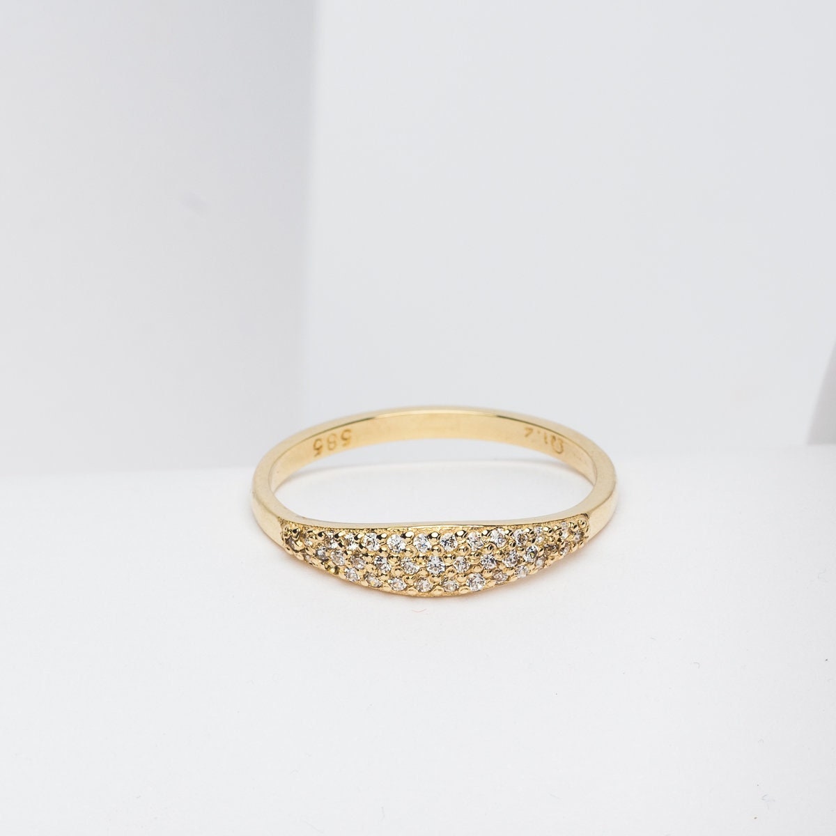 Handcrafted 14k solid gold ring set with white cubic zirconia stones, designed for women.