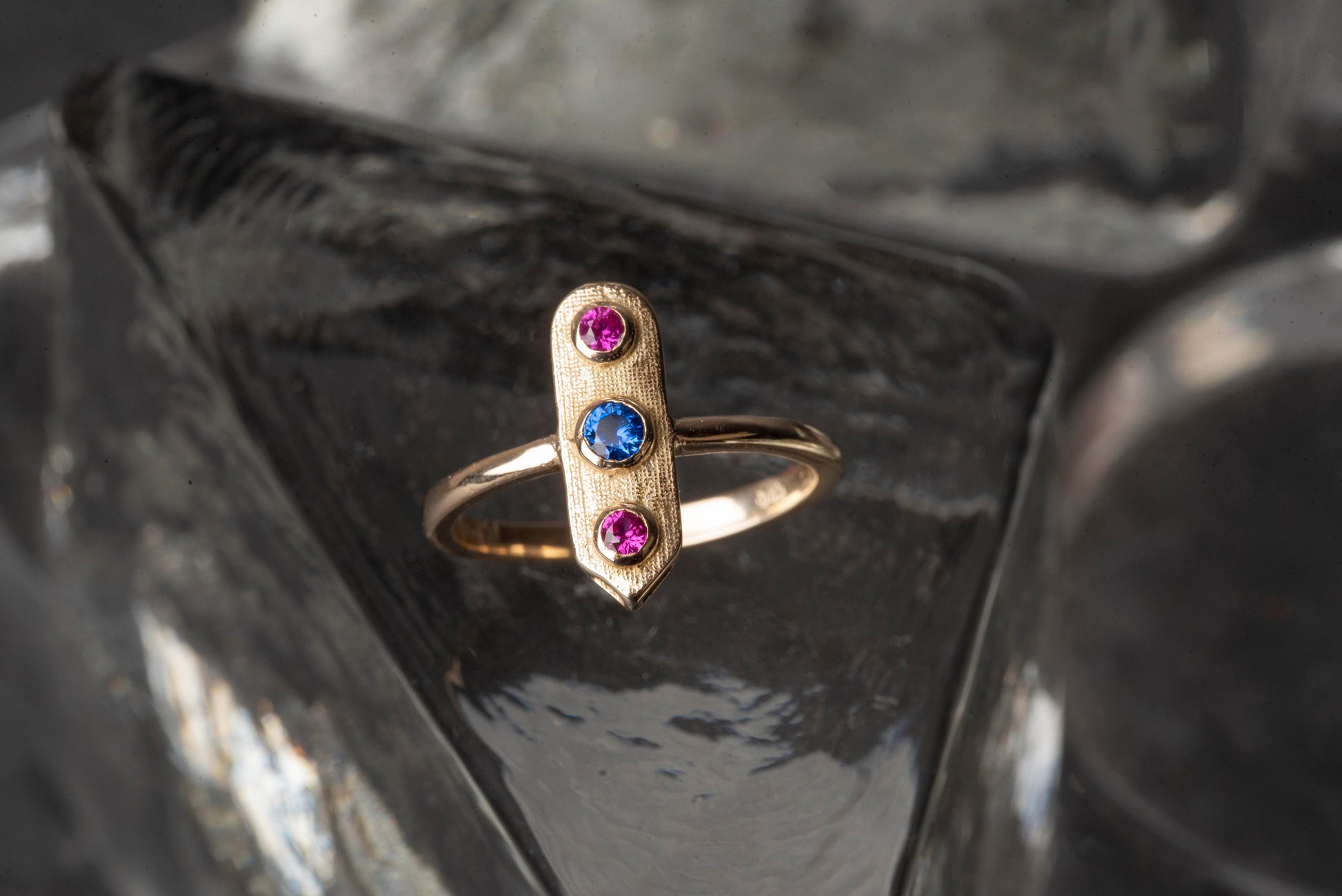 Handcrafted arrow-shaped gold ring with three gemstones set in 14k solid gold.