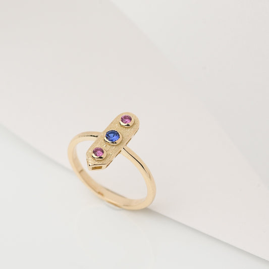 Handcrafted arrow-shaped gold ring with three gemstones set in 14k solid gold.