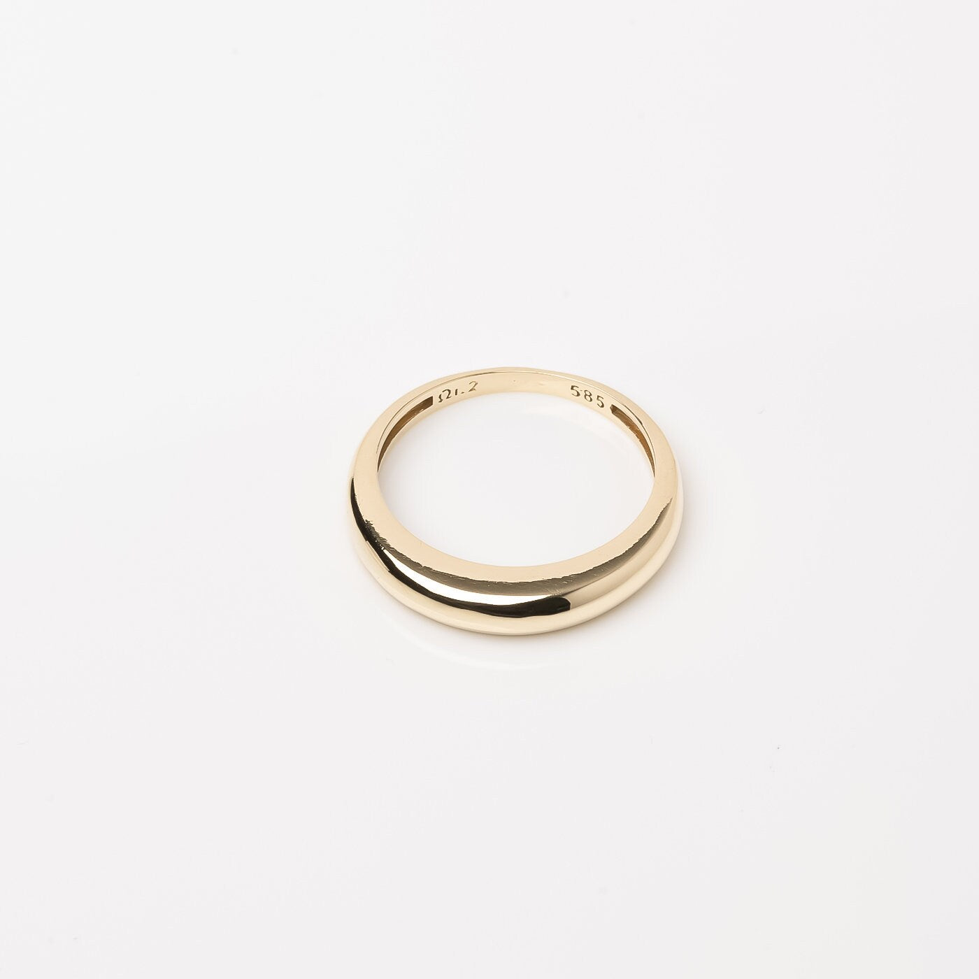 A thin dome ring made of 14k solid gold for women.