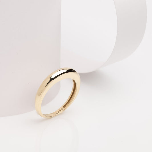 A thin dome ring made of 14k solid gold for women.