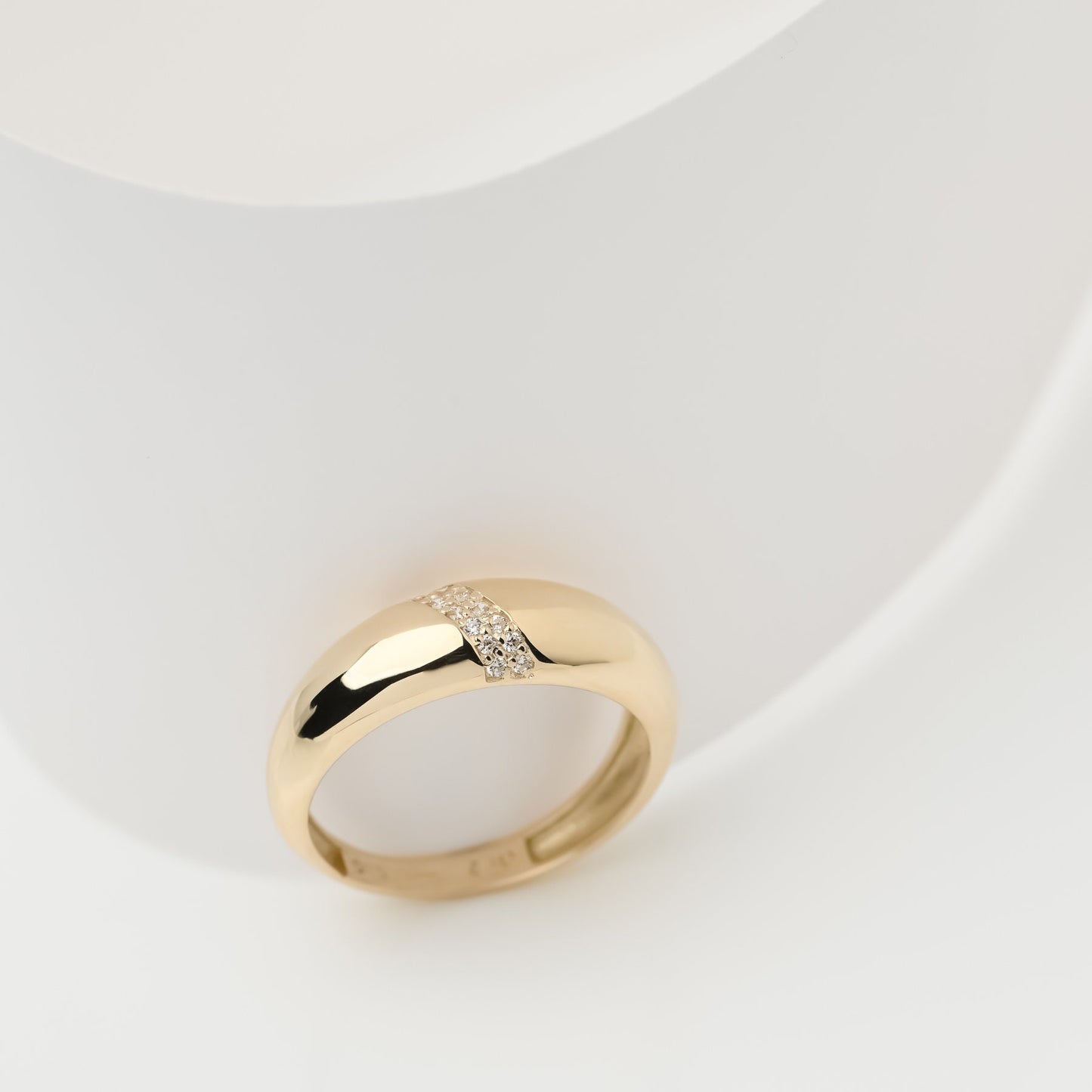 Handmade dome ring in 14k solid gold, partially paved with white cubic zirconia stones.