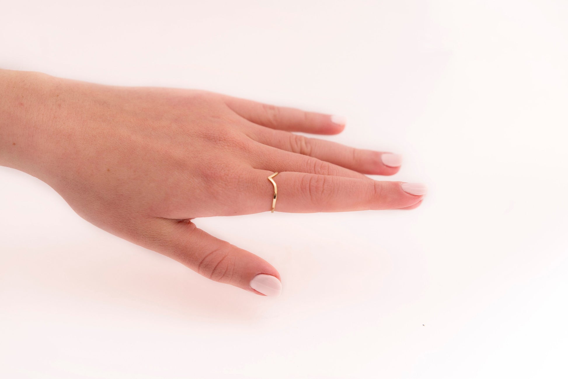 Slim chevron ring in 14k gold for women.