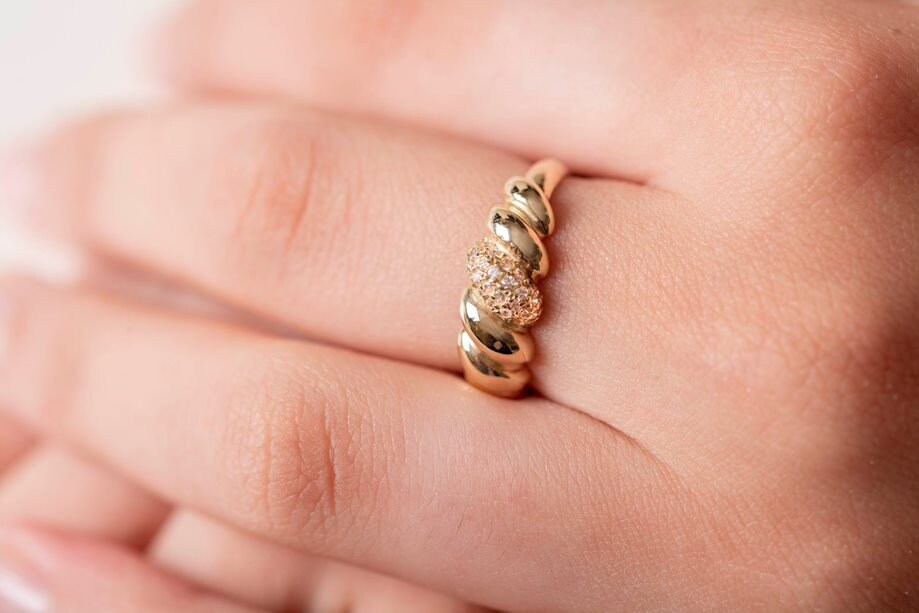 Handmade Croissant Ring in 14k gold, partially paved with white cubic zirconia stones.