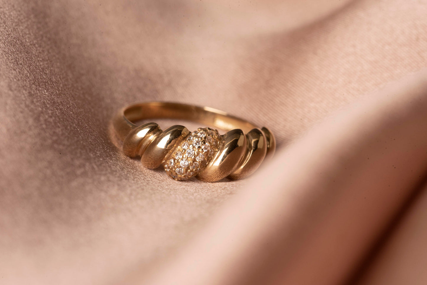 Handmade Croissant Ring in 14k gold, partially paved with white cubic zirconia stones.