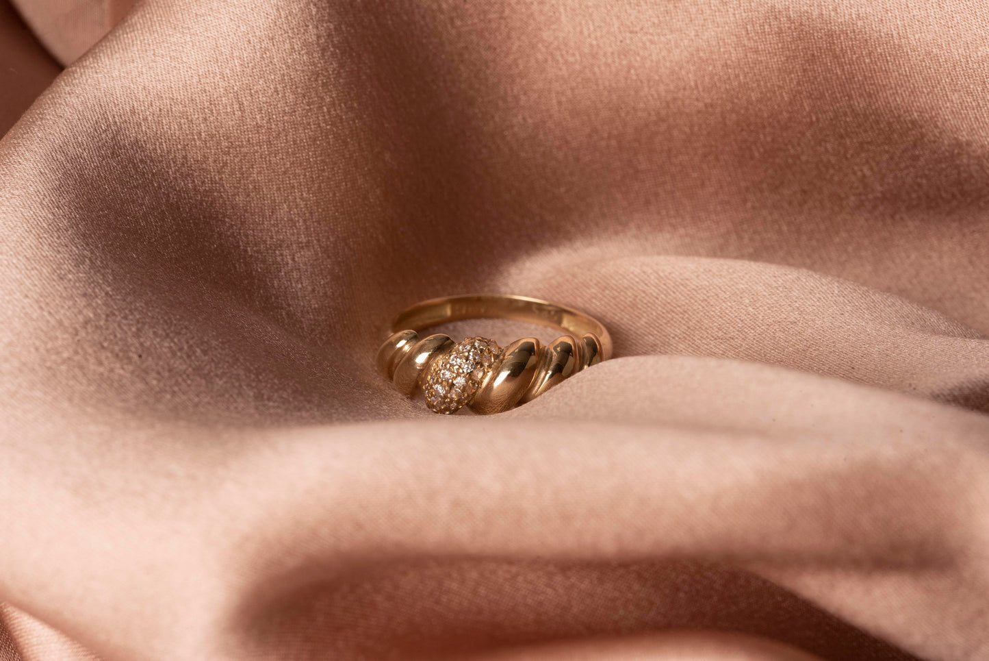 Handmade Croissant Ring in 14k gold, partially paved with white cubic zirconia stones.