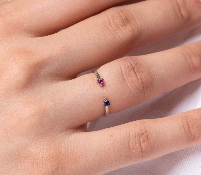 Handcrafted open cuff ring featuring rubies and sapphires, set in 14k gold for women.