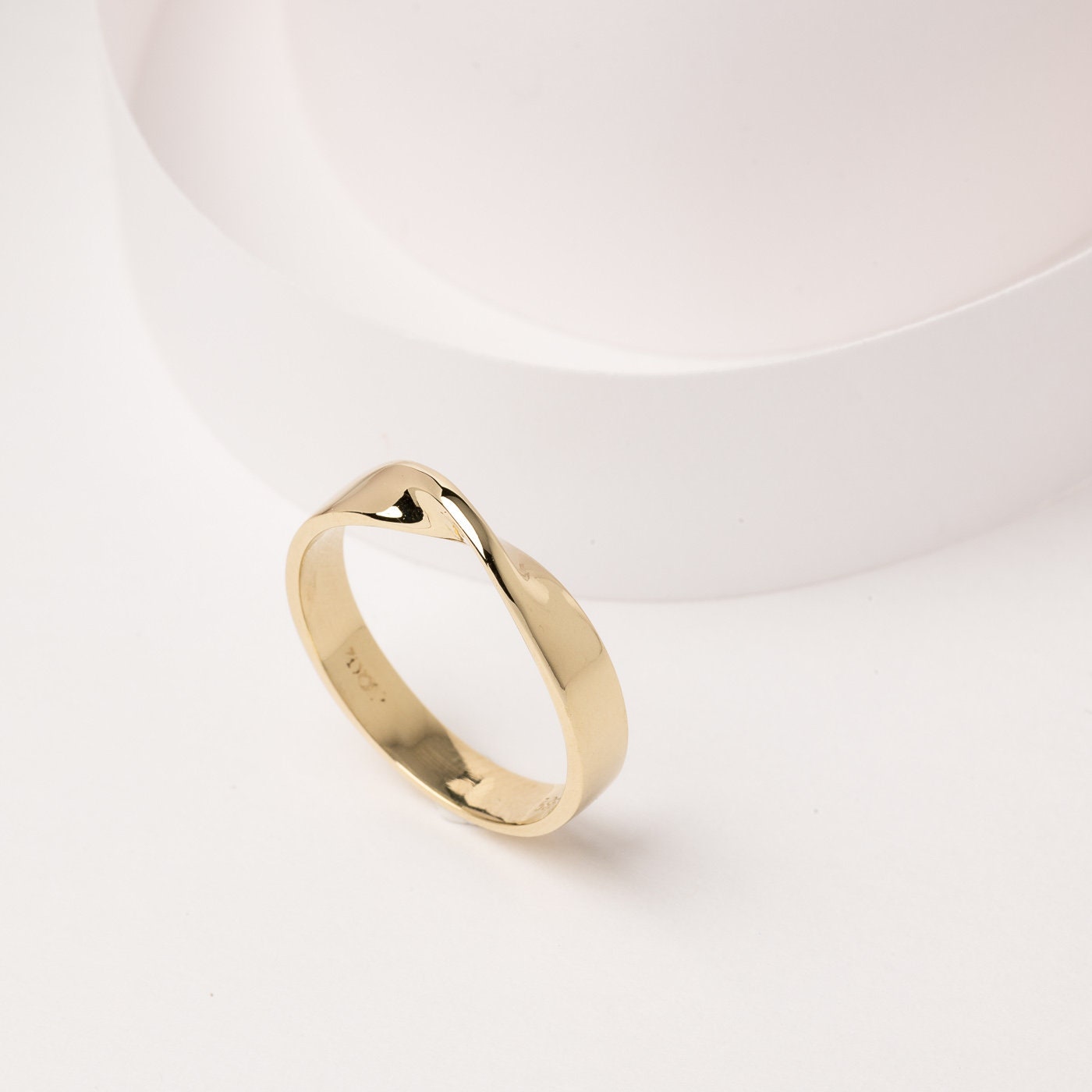 Thick Möbius ring in 14k solid gold for women.