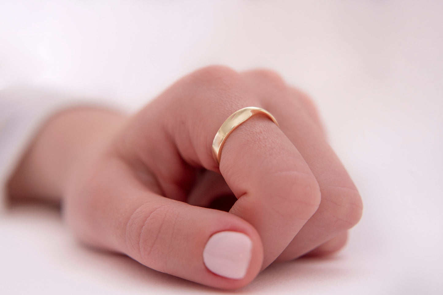 Thick Möbius ring in 14k solid gold for women.