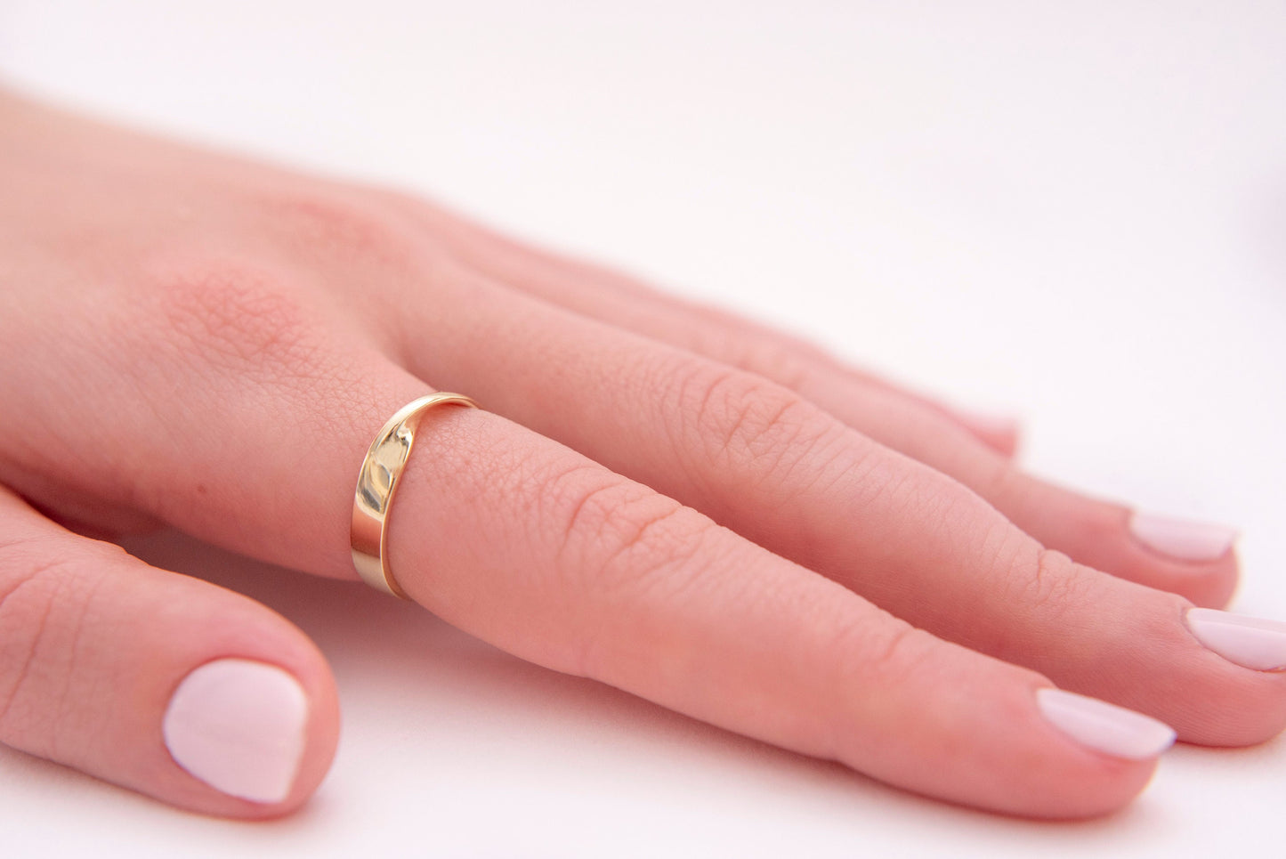 Thick Möbius ring in 14k solid gold for women.