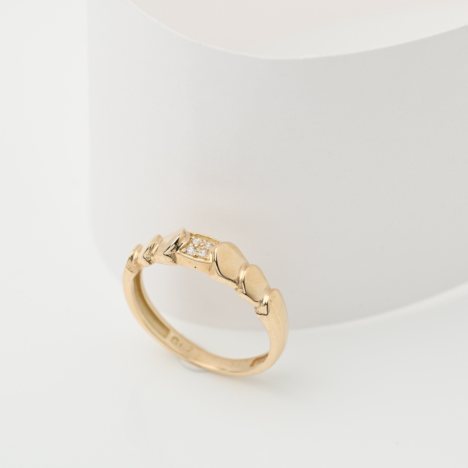 Handmade wrapped ring in 14k solid gold, the top part of the ring is encrusted with white cubic zirconia stones.