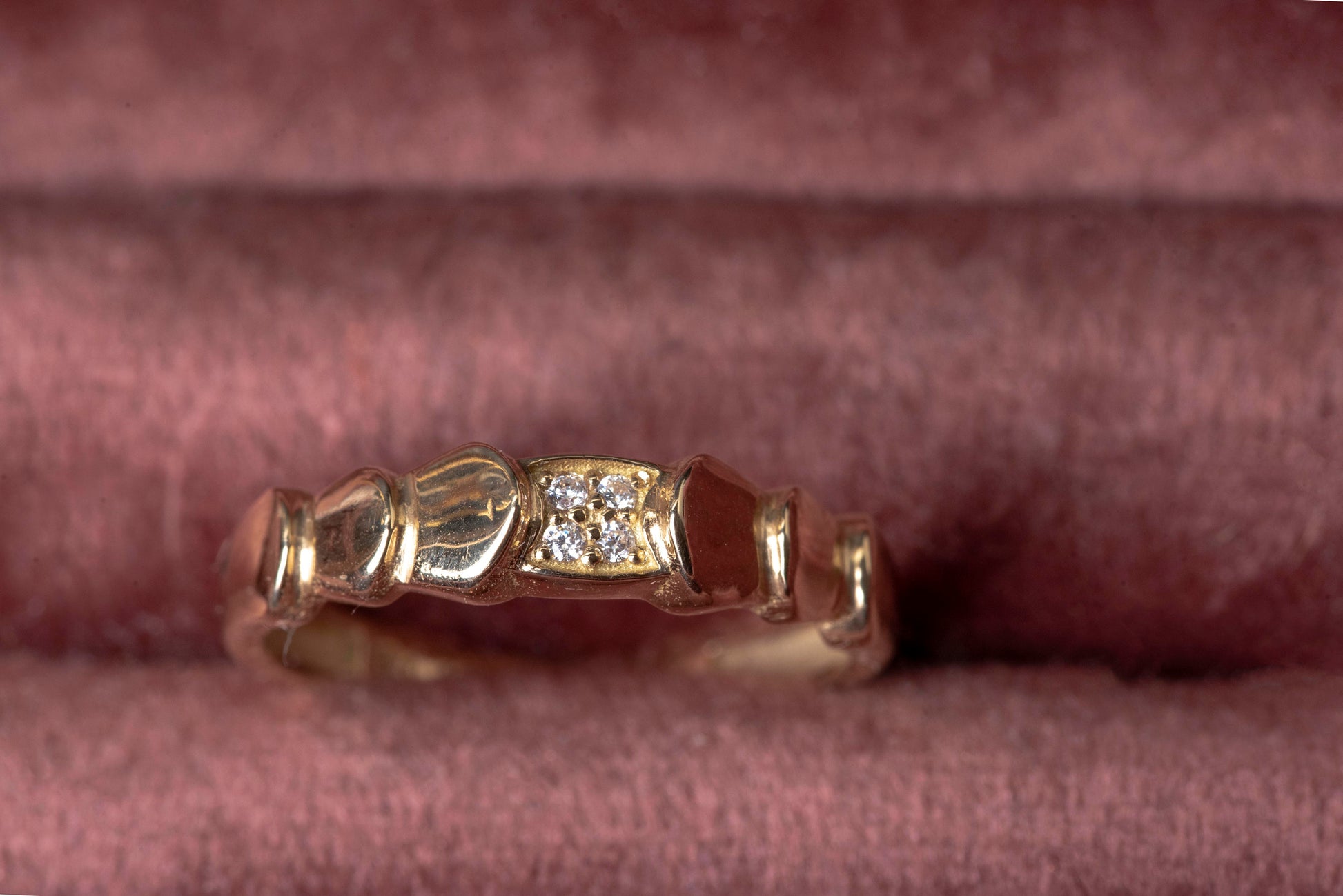 Handmade wrapped ring in 14k solid gold, the top part of the ring is encrusted with white cubic zirconia stones.