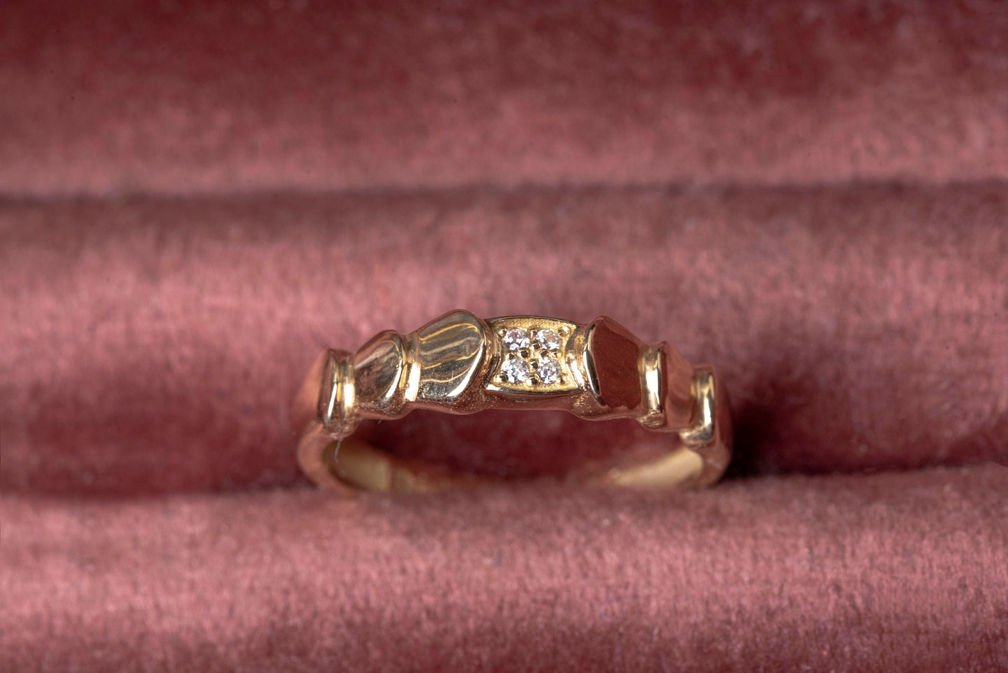 Handmade wrapped ring in 14k solid gold, the top part of the ring is encrusted with white cubic zirconia stones.