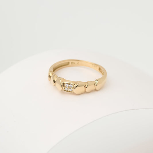 Handmade wrapped ring in 14k solid gold, the top part of the ring is encrusted with white cubic zirconia stones.