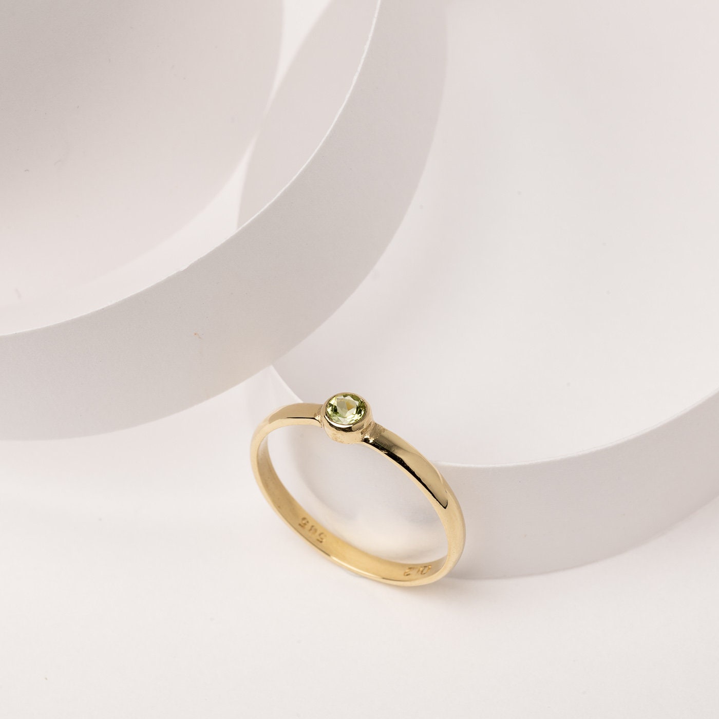 A handmade birthstone ring crafted in 14k solid gold, featuring a single stone in a bezel setting.