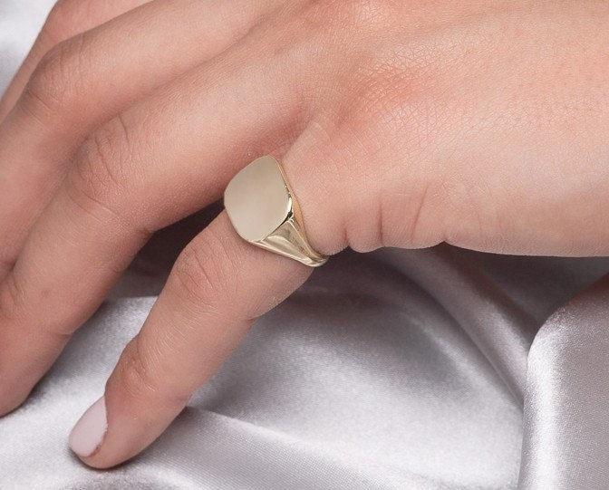 A square signet ring for women, crafted in 14k gold, customizable for a personal touch.