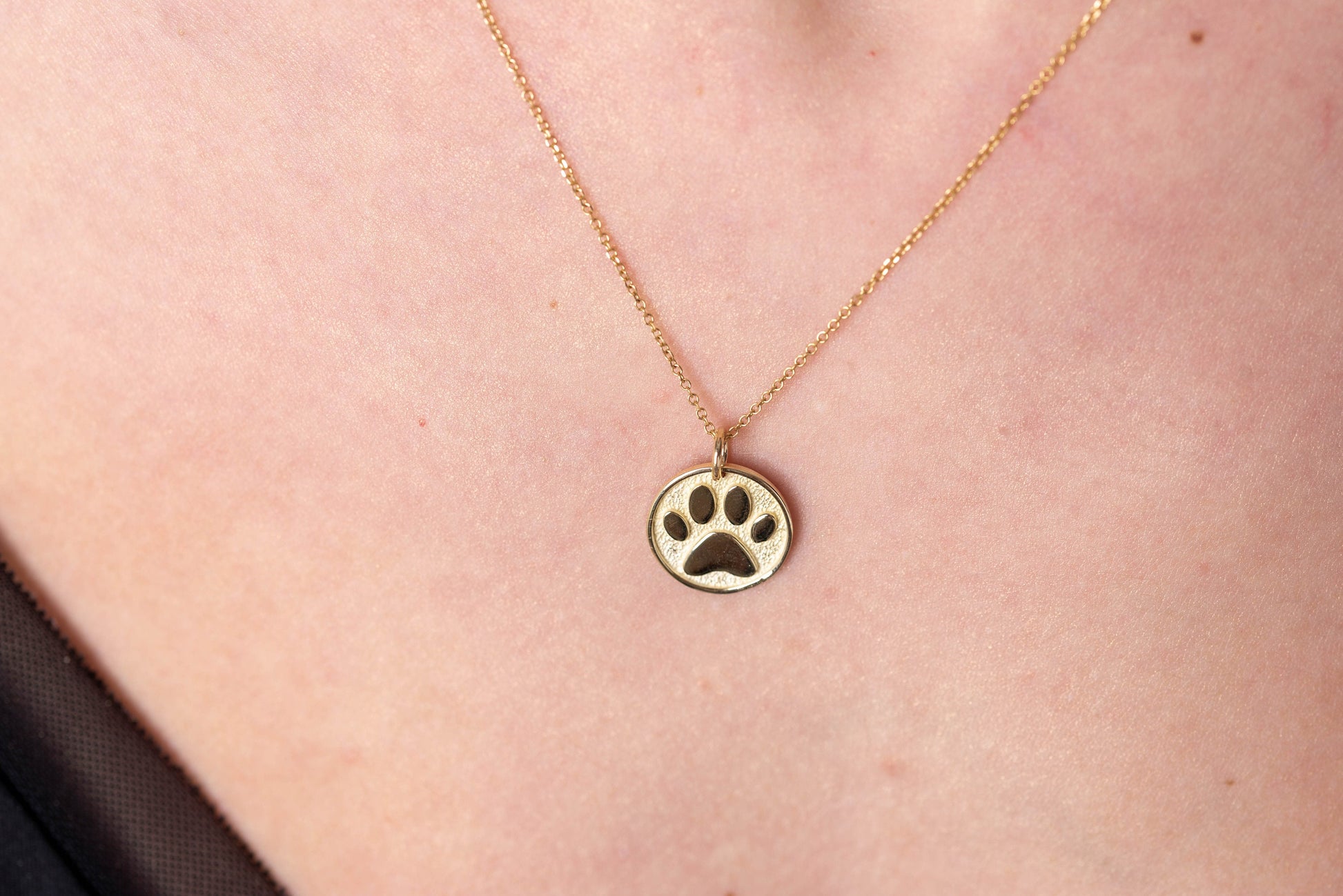 Paw Pendant crafted in 14k solid gold, complete with complimentary engraving on the reverse side.